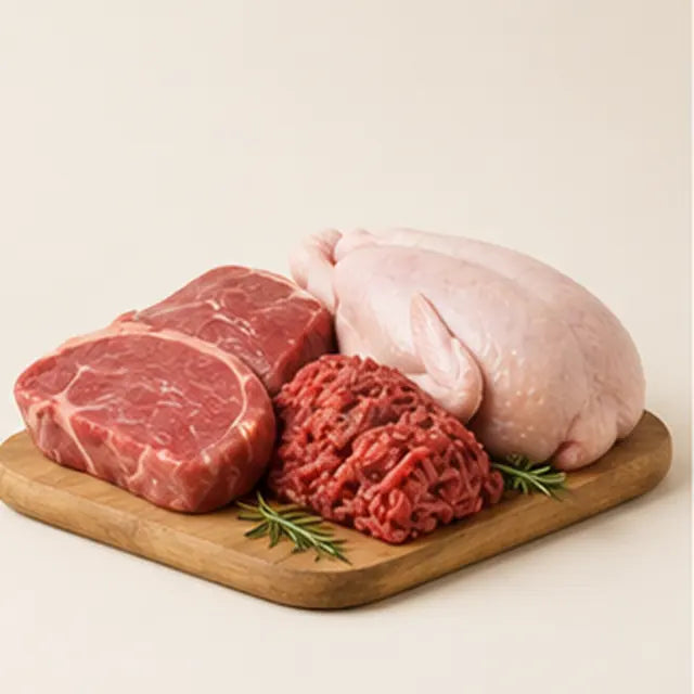 Meat and poultry arranged on a preparation board